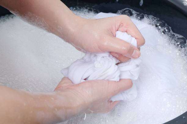 Washing white compression socks for women by hand to maintain their perfect fit and cleanliness.