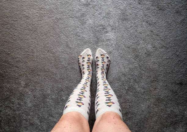 Overhead view of a woman's legs wearing stylish patterned compression socks for women.